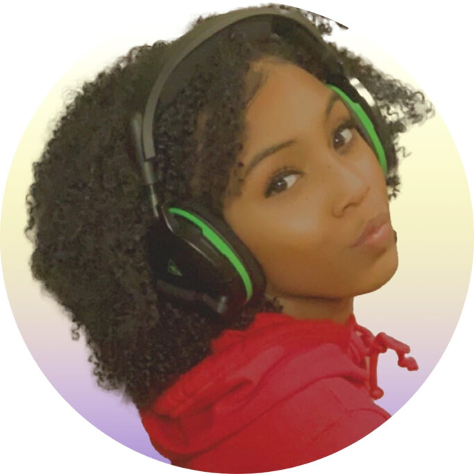 selenadeonx poses in a hoodie and Xbox wireless headset, looking at the camera.